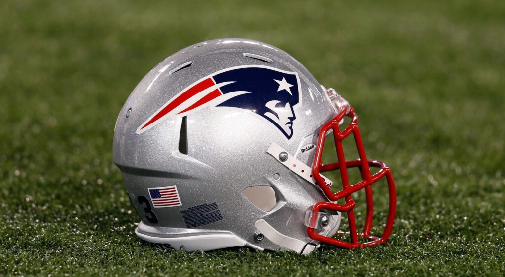 New England Patriots helmet on the field after a game