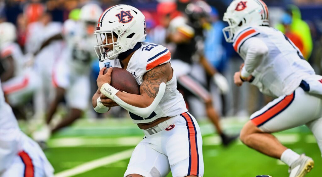 Auburn running back Brian Battie carrying the ball during  a game.