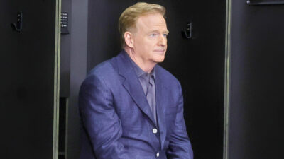 Roger Goodell sitting in NFL locker room