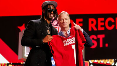 Marvin Harrison Jr. and Roger Goodell holding jersey