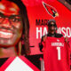 Marvin Harrison Jr. holding up his Cardinals jersey
