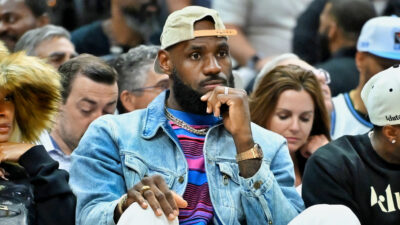 LeBron James sitting courtside at Celtics-Cavaliers game