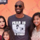 Vanessa Bryant posing with Kobe Bryant and their daughters