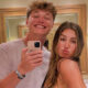 JJ McCarthy taking a selfie with fiancee Katya Kuropas