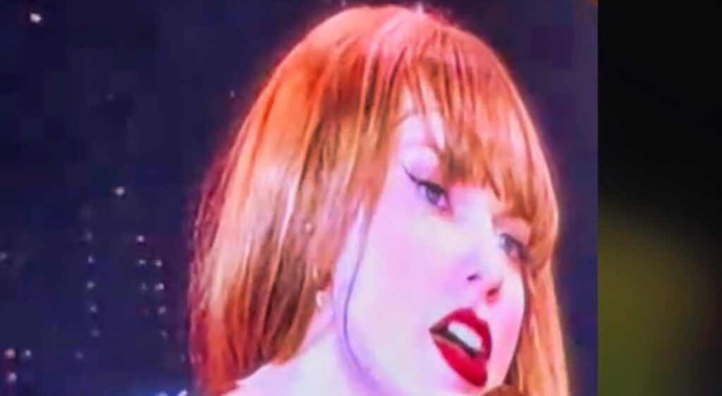 Taylor Swift on the jumbotron while performing during her concert.