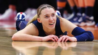 Paige Bueckers lying on the court.