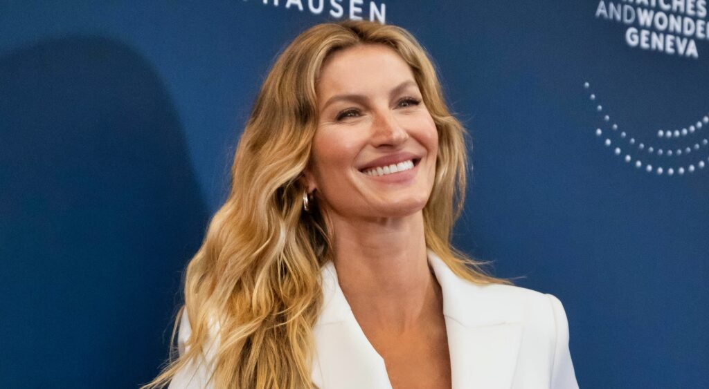 Gisele Bundchen smiling and posing