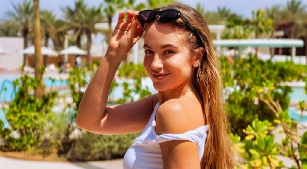 Rachel DeMita posing in white shirt