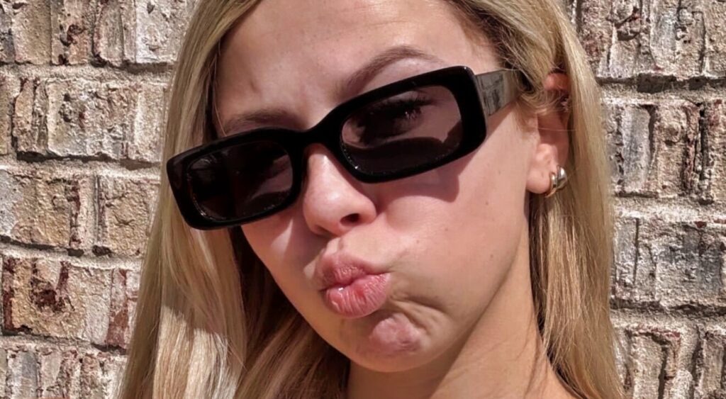 Haliey Welch posing in black sunglasses