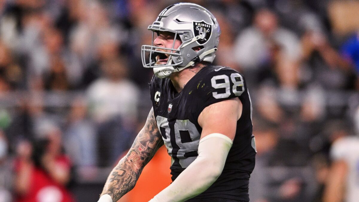 Las Vegas Raiders defensive end Maxx Crosby flexing his muscles.
