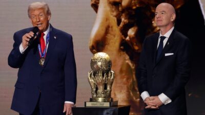 Donald Trump receiving award from Gianni Intantino