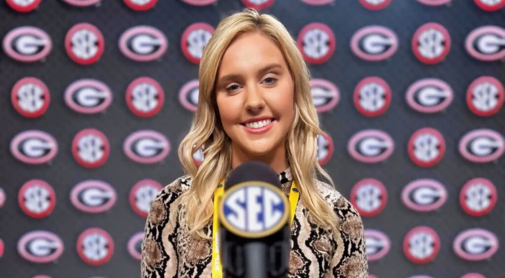 Crissy Ford posing in front of microphone