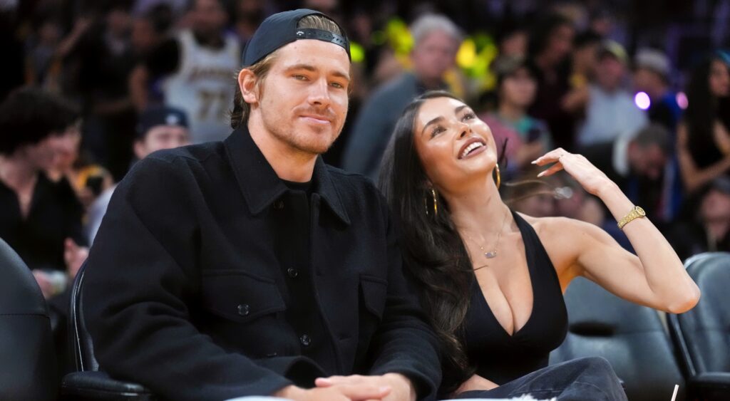 Los Angeles Chargers quarterback Justin Herbert (left) and girlfriend Madison Beer attend the game between the Minnesota Timberwolves and the Los Angeles Lakers at Crypto.com Arena.