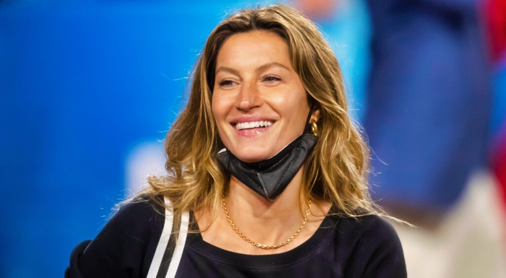 Gisele Bundchen on a football field.