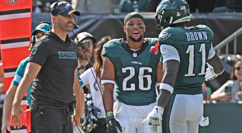 Head coach Nick Sirianni and running back Saquon Barkley (26) celebrate touchdown catch by wide receiver A.J. Brown (11)