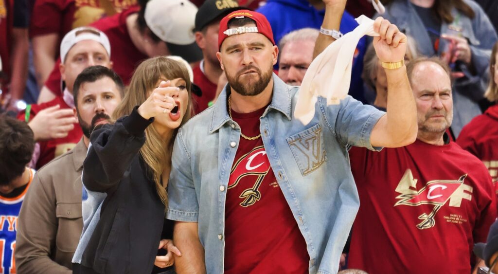 Taylor Swift and Travis Kelce on an NBA court.