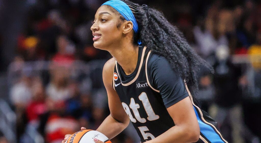 Angel Reese dribbling basketball