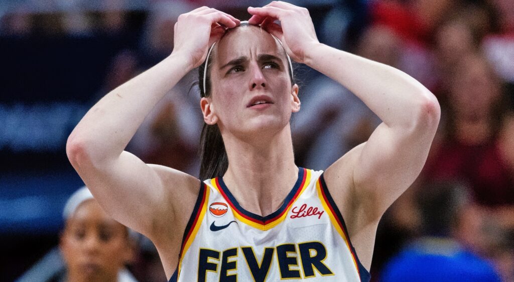 Caitlin Clark with her hands on her head