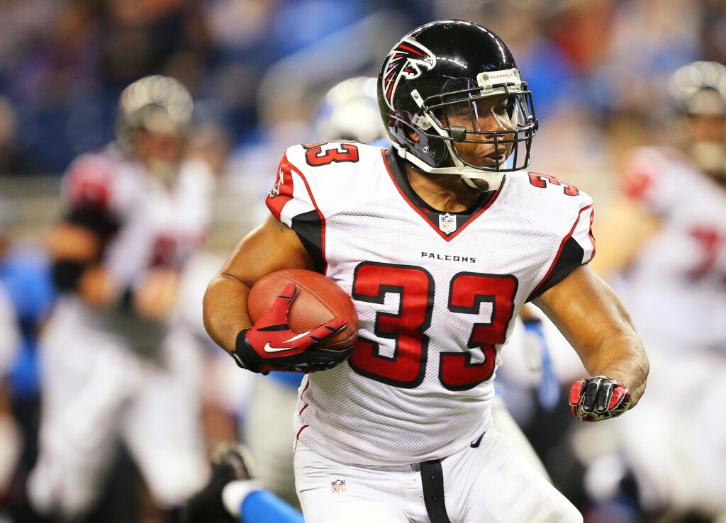 Michael Turner runnign with football