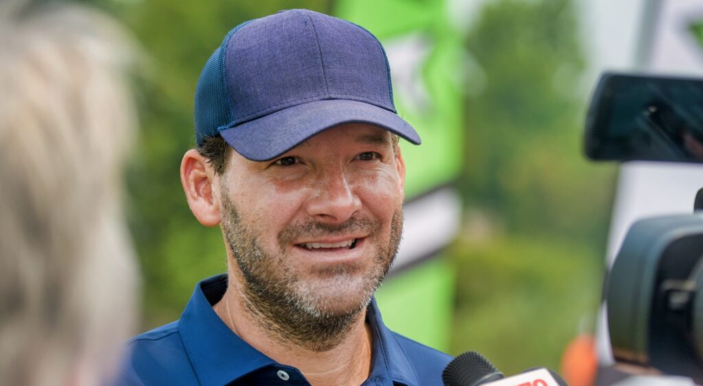 Tony Romo speaking to reporters.
