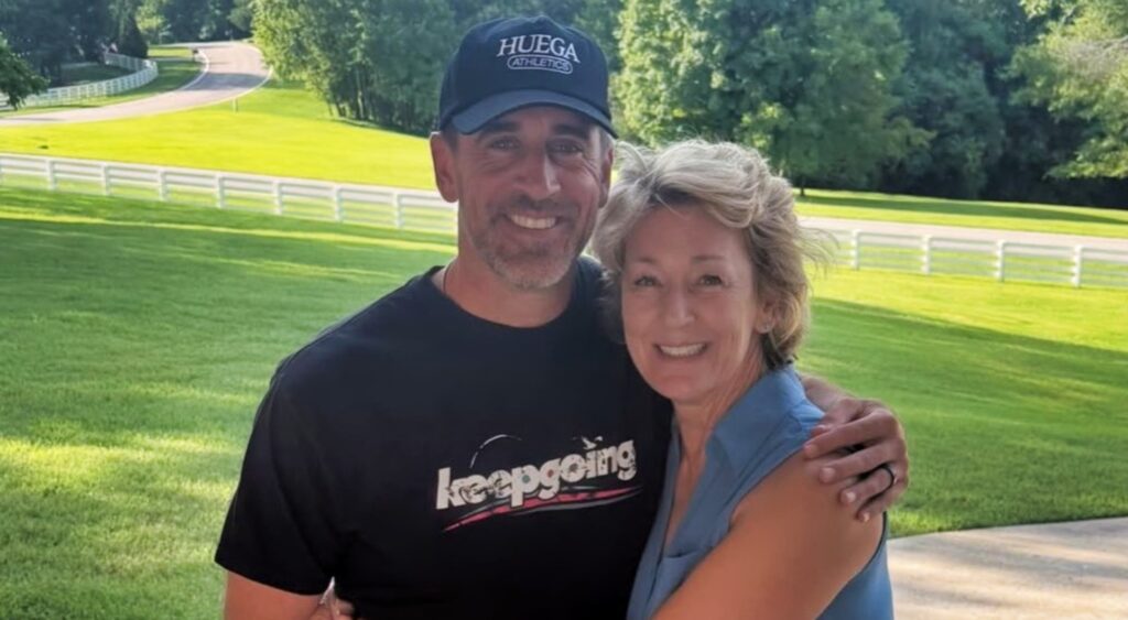 Aaron Rodgers and his mom posing for a picture.