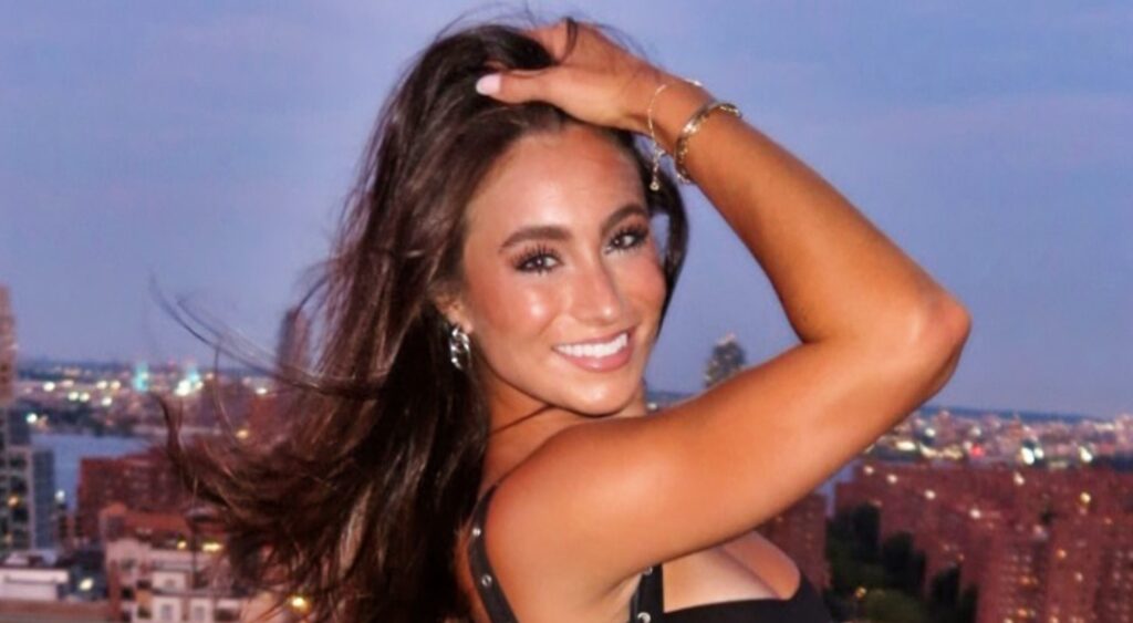 Abby Summers posing in black outfit.
