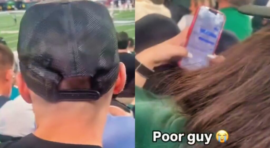Cheating Jets fan texting as guy watches the field.