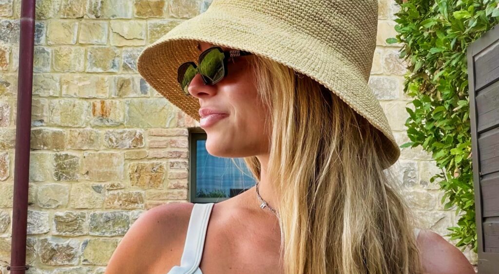 Katie Hoofnagle wearing a straw hat.