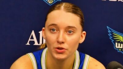 Paige Bueckers talking to reporters