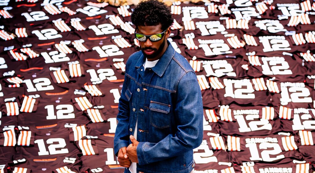 Shedeur Sanders surrounded by No. 12 jerseys