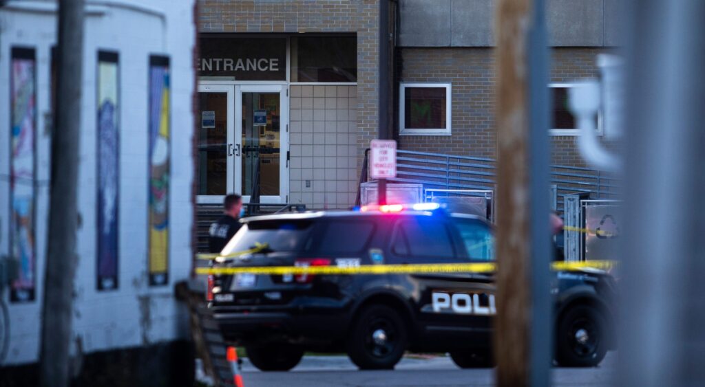 Police vehicle in front of building.