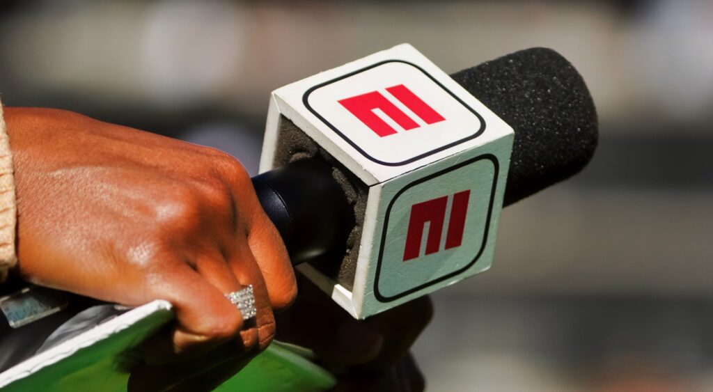 ESPN microphone being held.