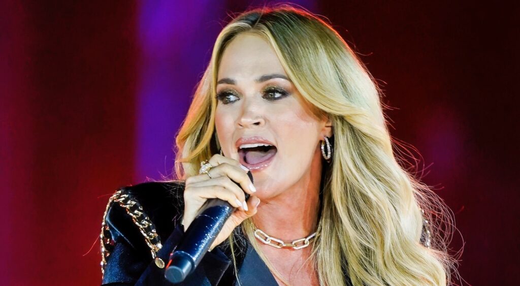 Carrie Underwood singing on stage.