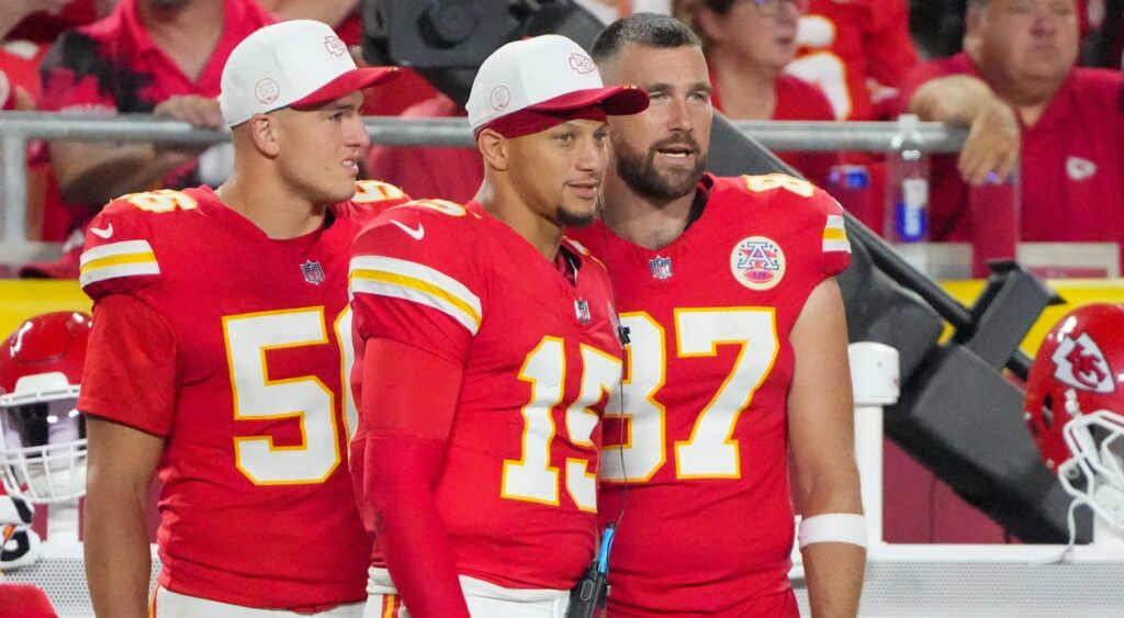 Patrick Mahomes and Travis Kelce look on.