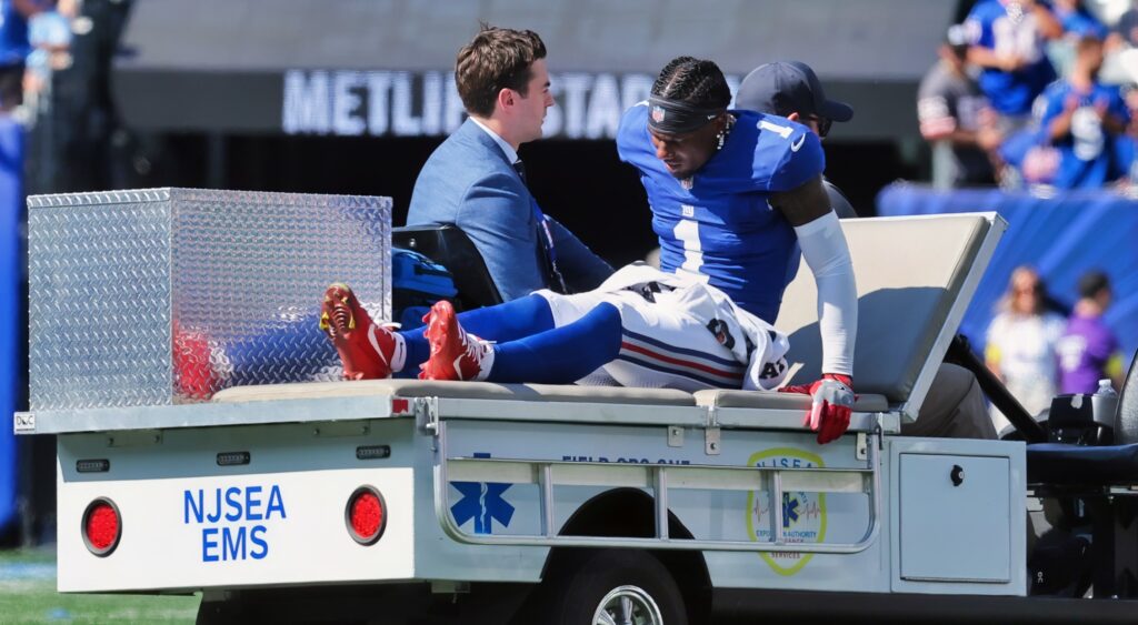 New York Giants wide receiver Malik Nabers (1) is carted off the field.