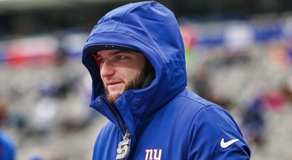 Cam Skattebo in Giants jacket.
