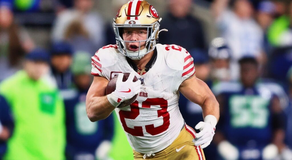 Christian McCaffrey running football