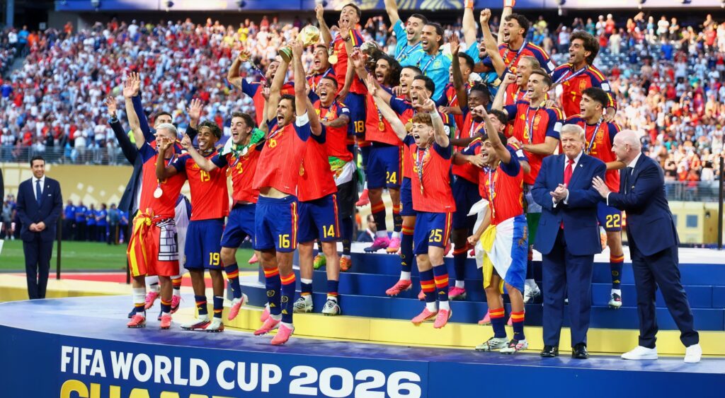 General view as Spain players celebrate with the trophy after winning the World Cup as U.S. President Donald Trump and FIFA President Gianni Infantino look on.