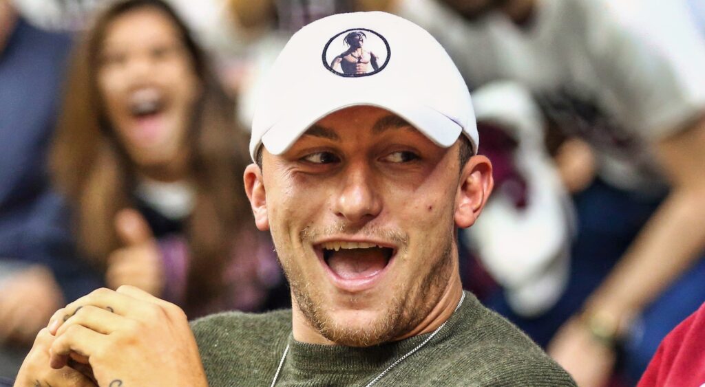Johnny Manziel sitting on the sidelines.