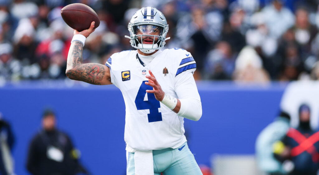 Dak Prescot throwing a football.