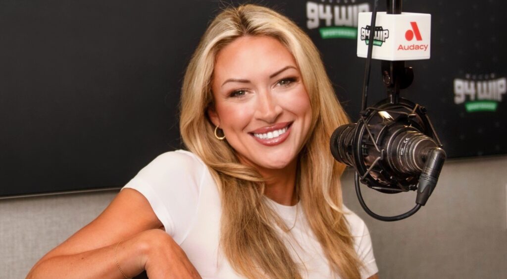 Devan Kaney in front of a mic.