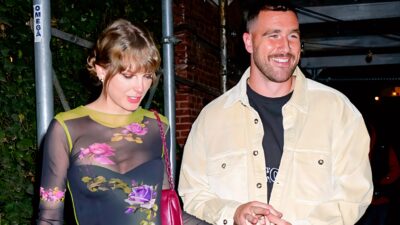 Taylor Swift and Travis Kelce smiling