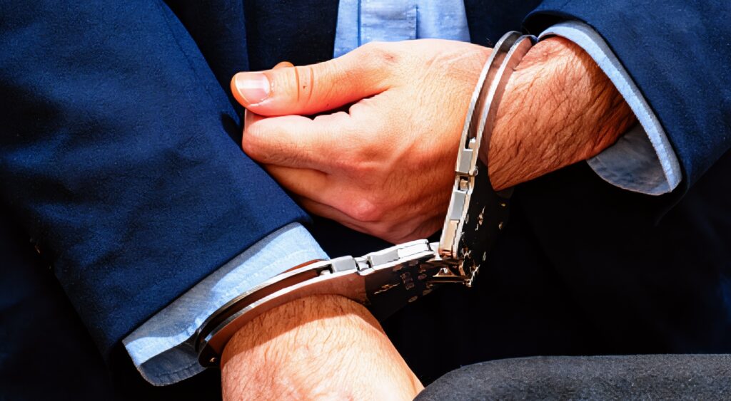 Defendant in handcuffs