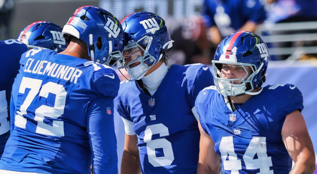 New York Giants players celebrating a touchdown.