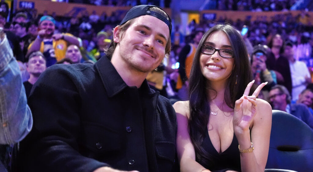 Justin Herbert and Madison Beer at a game.