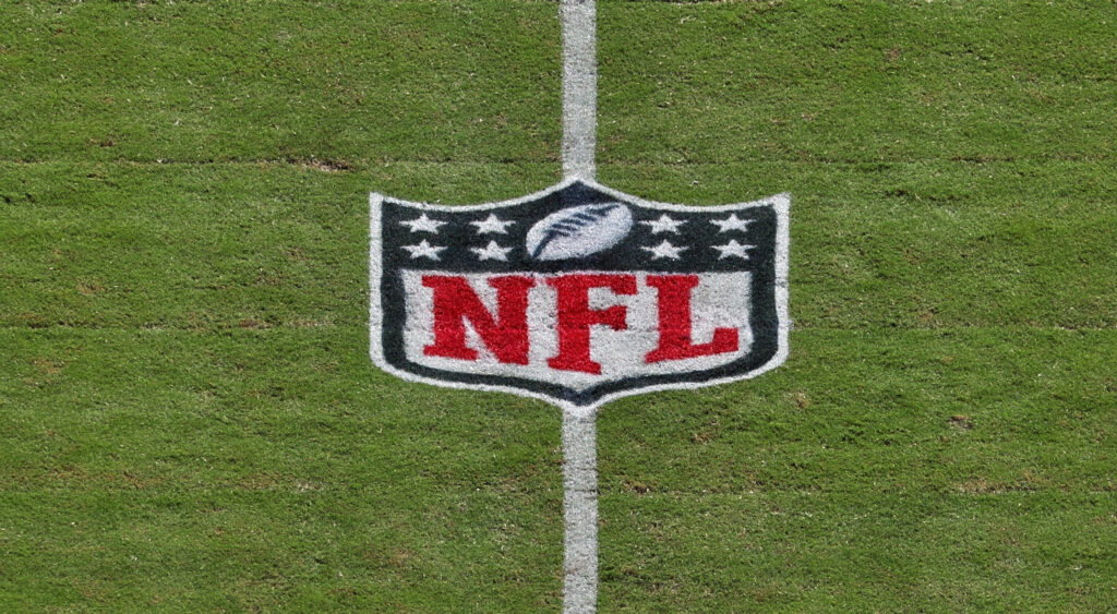 NFL logo on the field.