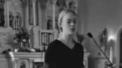 Sophie Cunningham singing in church.