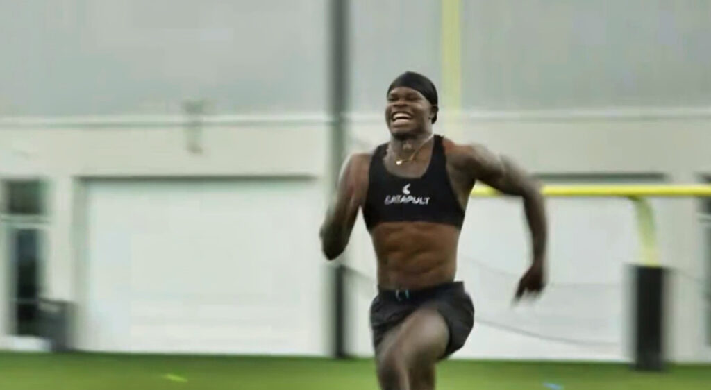 Travis Hunter running.